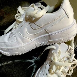 Girls Size 5 Nike Air Force sneaker in white.